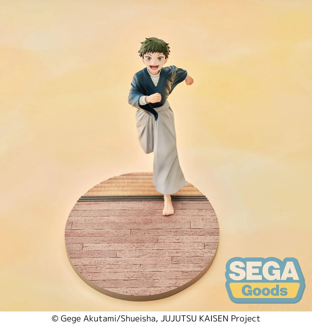 Luminasta Naoya Zen’in Childhood figure running barefoot in a blue top and gray hakama, smiling on an oval base with wood-style flooring.