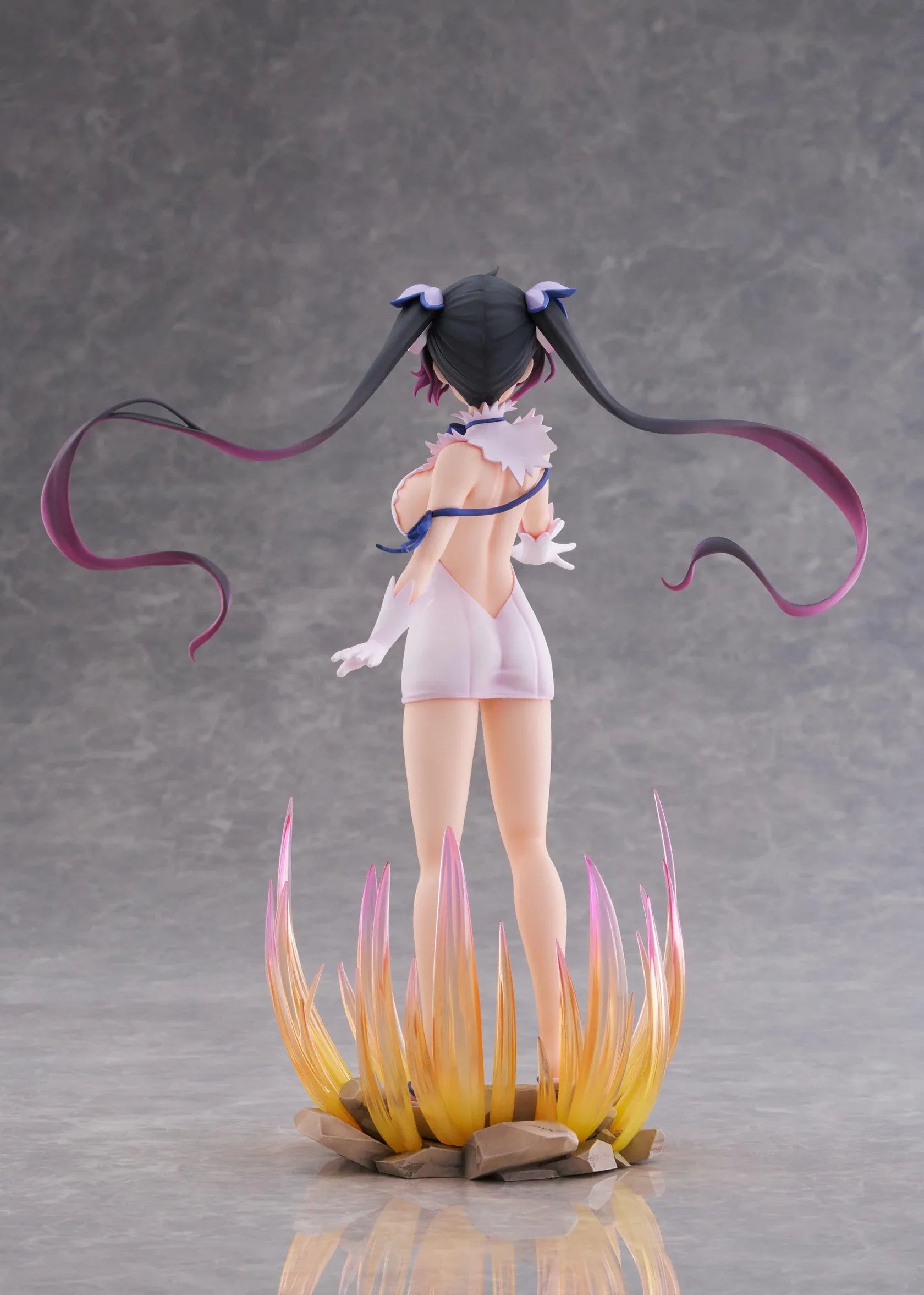 Is It Wrong to Try to Pick Up Girls in a Dungeon V Hestia Divinity Unleashed Limited Edition Ver. 1/7 Scale Figure with twin-tails, white outfit, blue ribbon accents, rocky base, and flame effect parts