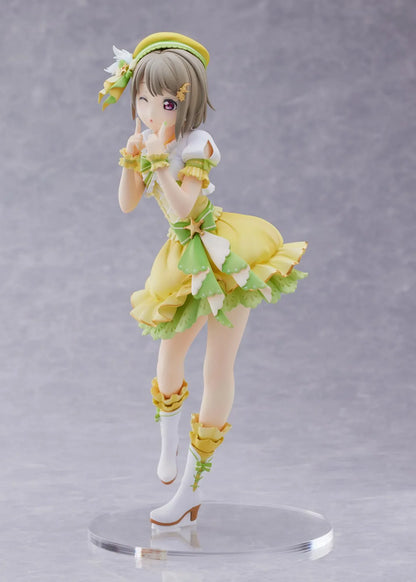 Love Live Nijigasaki High School Idol Club Kasumi Nakasu 1/7 Scale Figure featuring Kasumi in a yellow and green idol outfit with a winking expression, ribbon accents, and matching boots.