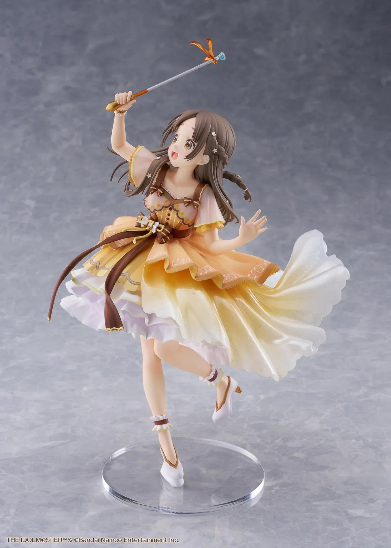 The Idolmaster Gakuen China Kuramoto 1/7 scale anime figure in a flowing yellow stage dress holding a microphone