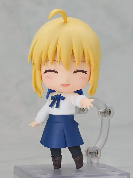 Fate stay night Nendoroid Saber Casual Outfit Ver. Figure featuring Saber with blonde hair, green eyes, white blouse, blue skirt, and sword accessory.