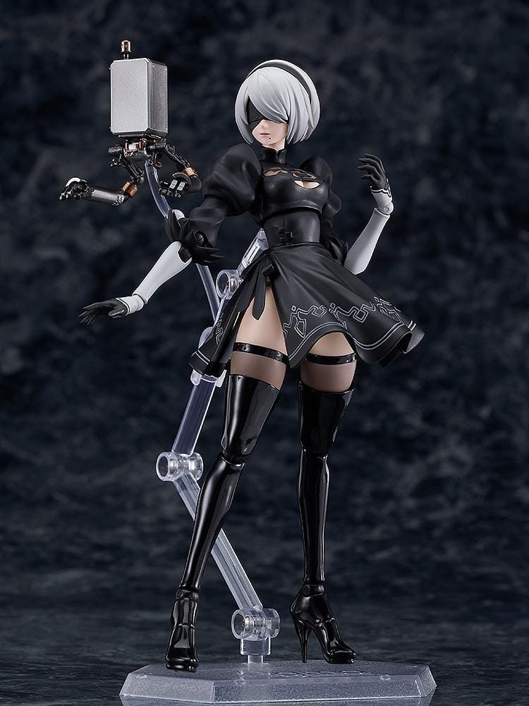 NieR Ver1.1a figma 2B figure with silver hair, a black visor, patterned black outfit, white sleeves, glossy boots, and a support robot.