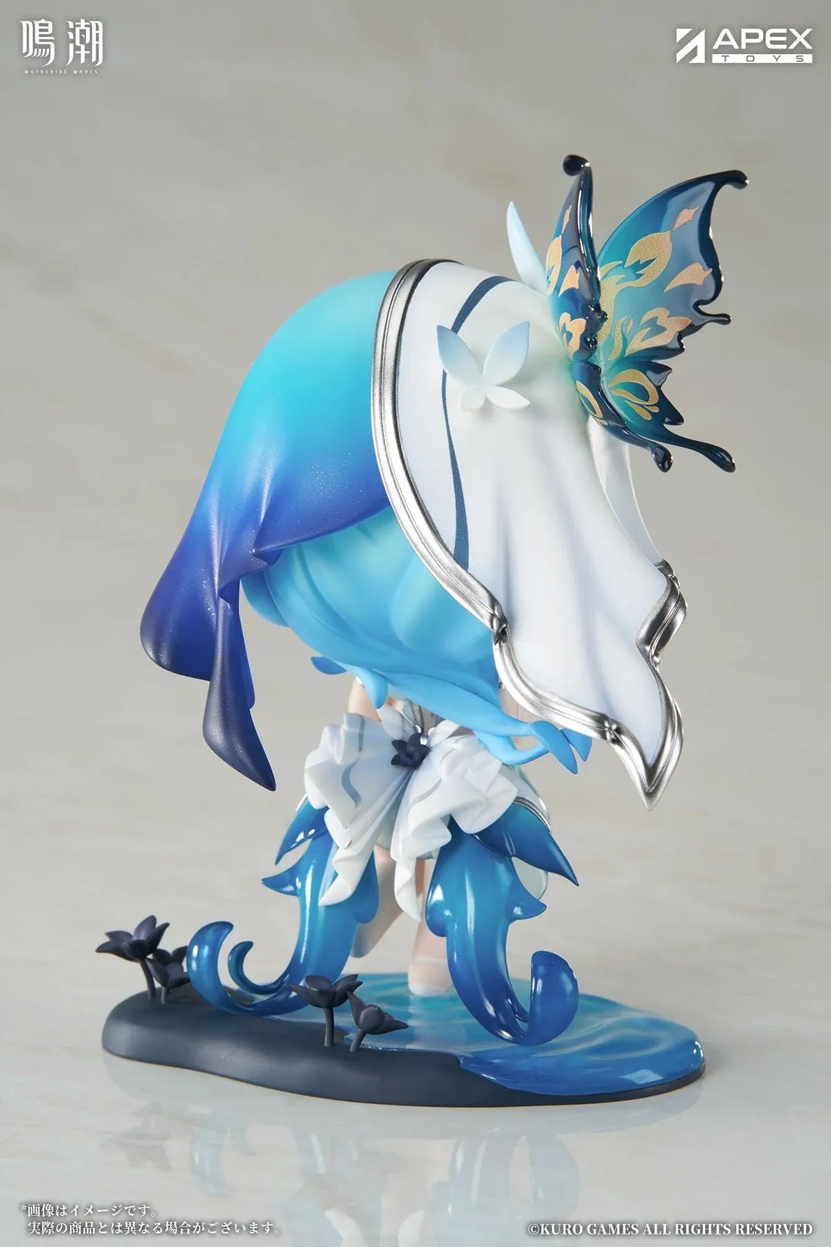 Chibi Shorekeeper Jinseki Series figure with blue hair, a butterfly-decorated headpiece, and a blue butterfly held in her hands, standing on a water-inspired base.