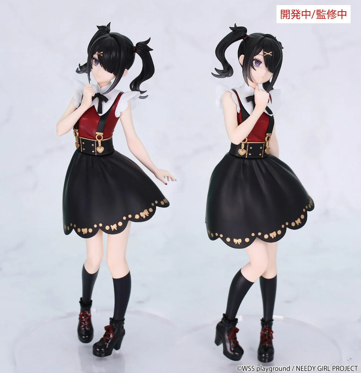 Prototype NEEDY GIRL OVERDOSE Vivit AME-CHAN figure with black twin ponytails, a red-and-black dress, gold-colored details, and platform boots.