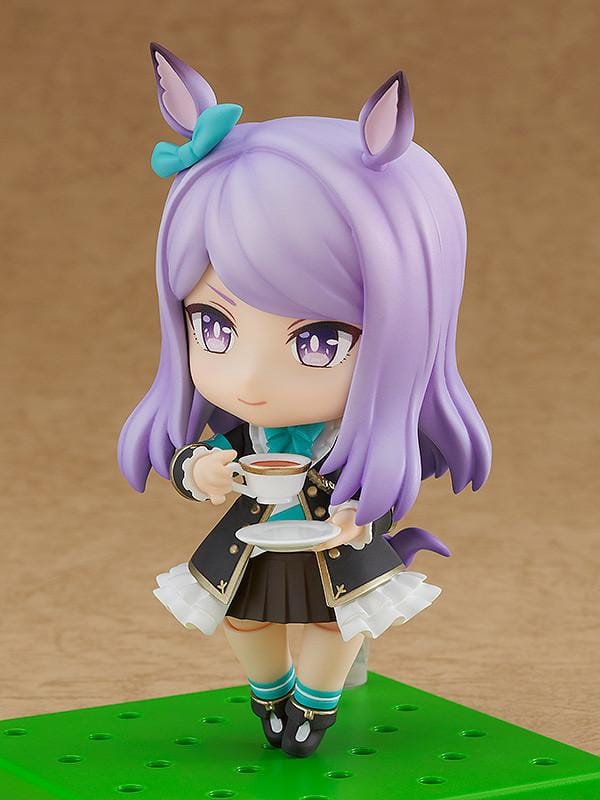 Umamusume Pretty Derby Nendoroid Mejiro McQueen rerelease figure with lavender hair, horse ears, and a black-and-teal racing uniform.
