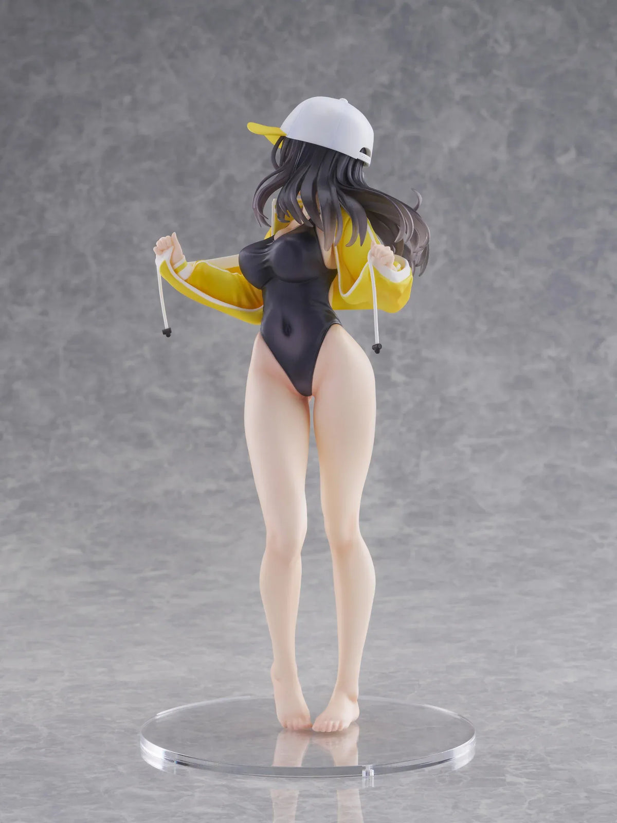 KoiKoi Sakura Kyou kara Suieibu Komon no Tama-chan Sensei 1/6 Scale Figure featuring a dark-haired anime woman with golden eyes wearing a black swimsuit, yellow athletic jacket, and white cap with a yellow brim, posing barefoot on a transparent circular base.