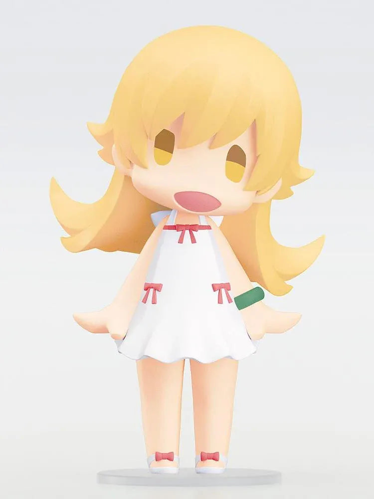 Monogatari Series HELLO! GOOD SMILE Shinobu Oshino Figure featuring a blonde-haired anime girl with golden eyes, a cheerful expression, white dress decorated with red bows, and matching shoes in a cute chibi design.