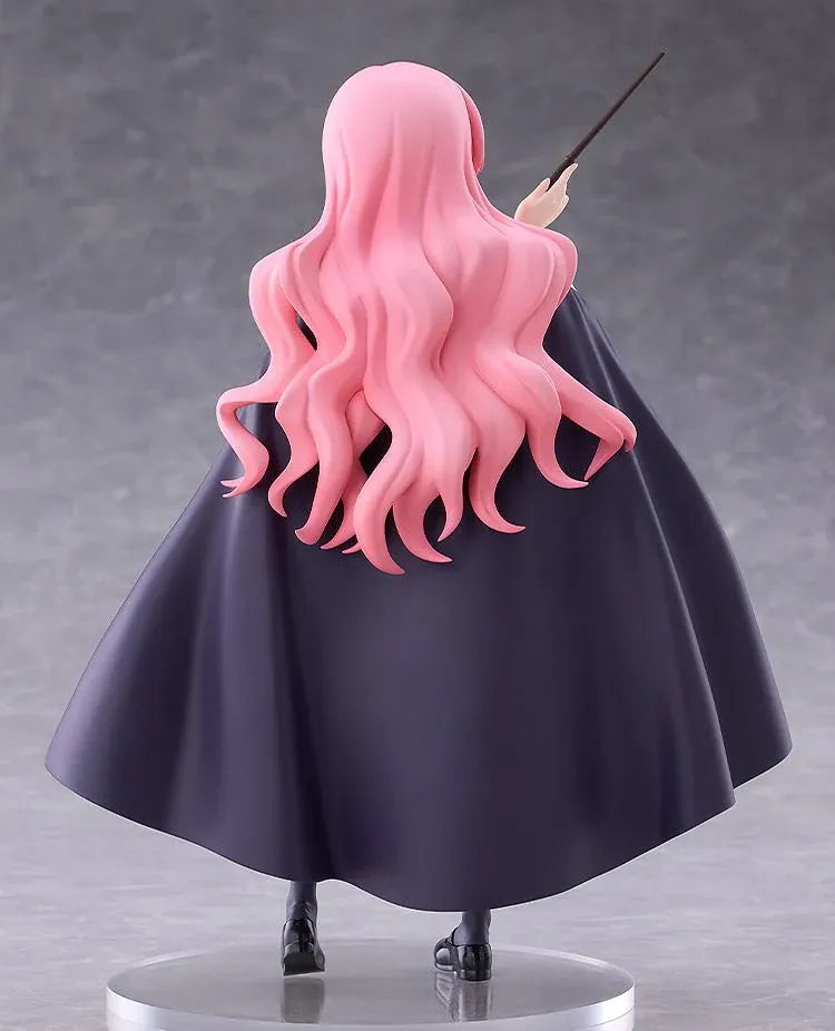 POP UP PARADE Louise L Size figure with flowing pink hair, a raised wand, white blouse, dark skirt, and a cape with burgundy lining.