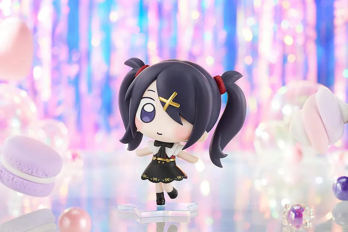 NEEDY STREAMER OVERLOAD Ame chibi figure with dark purple twin tails, gold cross hair clip, black and white outfit, and blue star-shaped base.