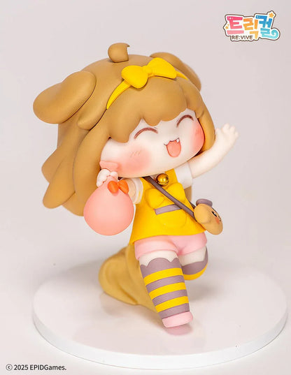 Trickal Chibi Go Butter Non Scale Figure (Rerelease) featuring a cheerful brown-haired character with floppy dog ears, a yellow bow, pink shorts, striped stockings, and a puppy-shaped shoulder bag.