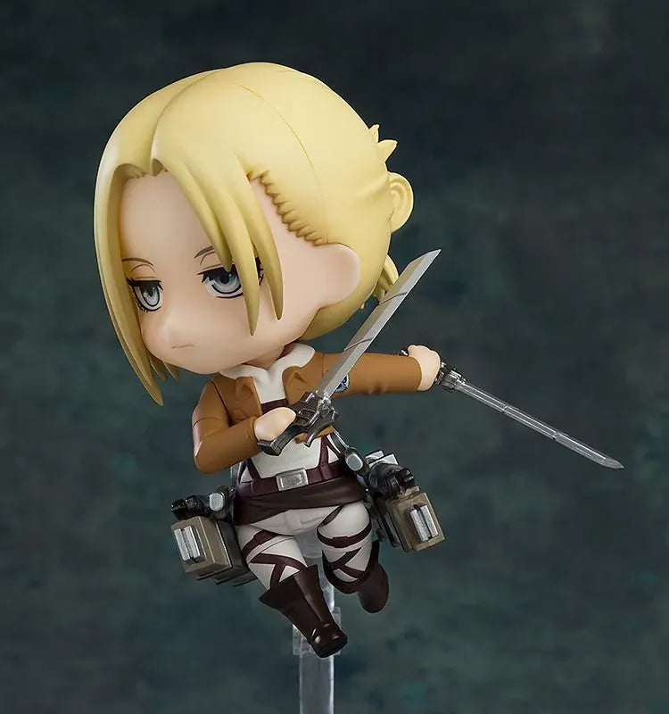 Attack on Titan Nendoroid Annie Leonhart rerelease figure with blonde hair, military uniform, dual blades, and vertical maneuvering equipment.