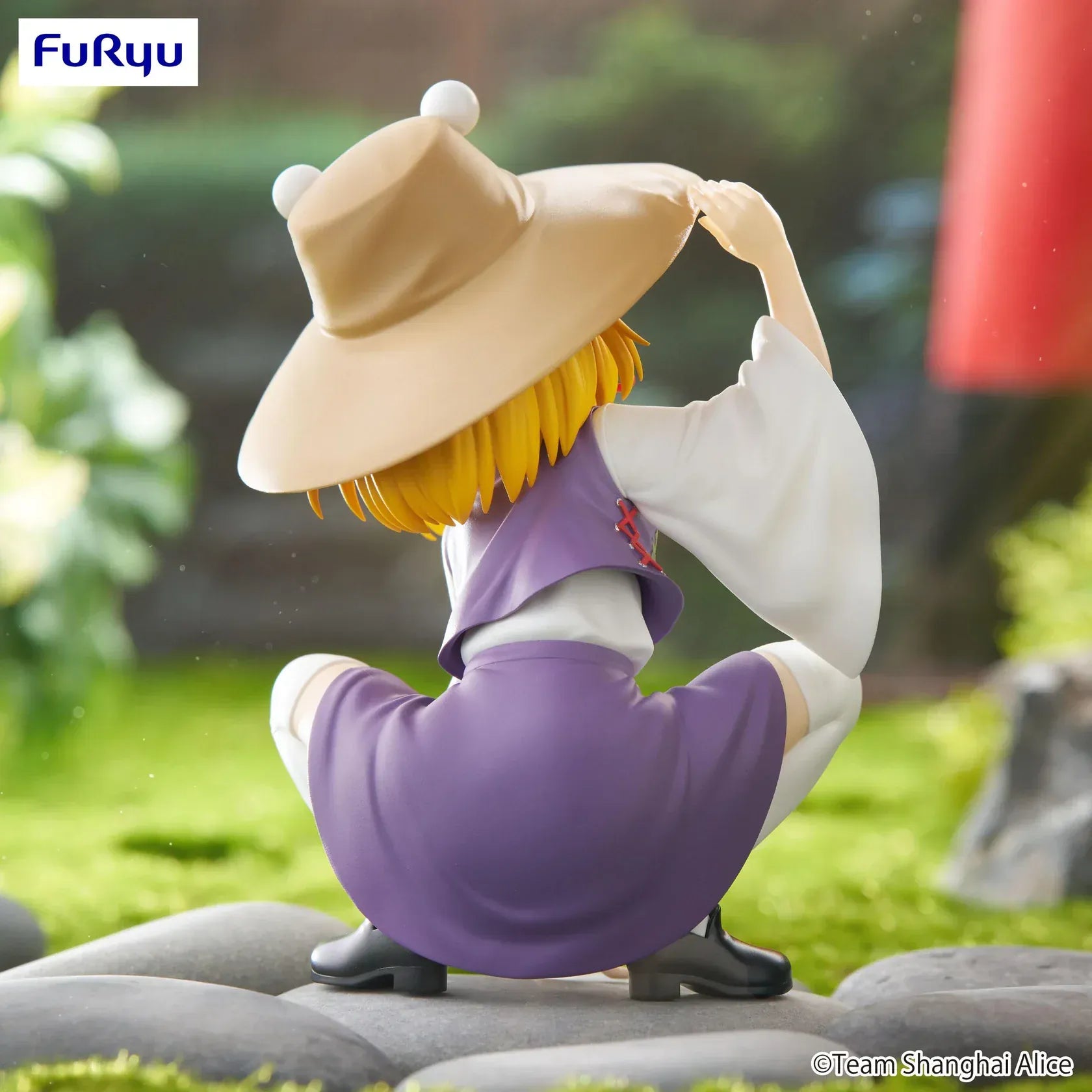 Noodle stopper figure of Touhou Project’s Suwako Moriya crouching playfully in a purple dress with frog-eye hat, designed to sit on the edge of a cup or shelf.