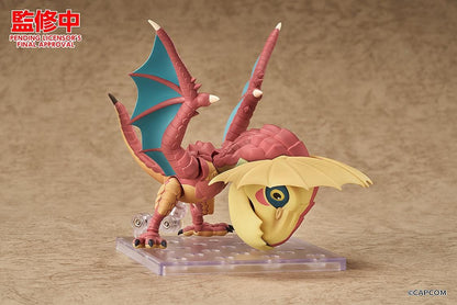 Monster Hunter Nendoroid Yian Kut-Ku with yellow ear fans, an open beak, pink-red scales, and spread wings with turquoise membranes.