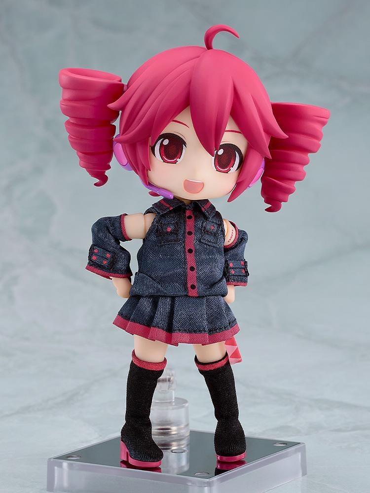 Kasane Teto Nendoroid Doll with pink drill-shaped twin tails, a headset microphone, and a dark fabric outfit with pink trim, posed waving.