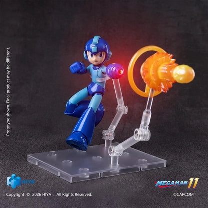 Mega Man Original Series action figure by Hiya Toys with interchangeable faces, hands, Mega Buster, charged-shot effect, and clear display stand.