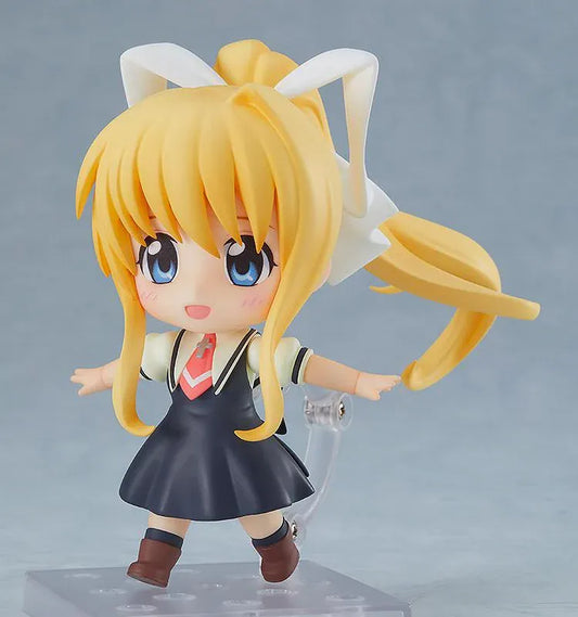 KAGINADO Nendoroid Misuzu Kamio figure featuring blue eyes, long blonde hair, an oversized white ribbon, a dark school dress, and a red necktie.
