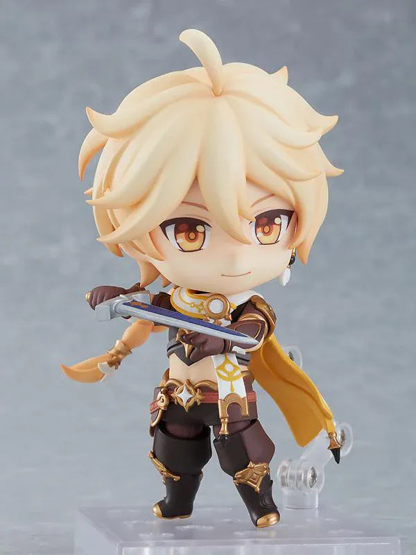 Genshin Impact Nendoroid Traveler Figure Aether Rerelease featuring Aether with blonde hair, golden eyes, fantasy outfit details, yellow cape, and sword accessory.