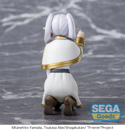 Perching figure of Frieren from Frieren: Beyond Journey’s End kneeling on a stone-like base, reaching forward to poke something, with long silver hair, elf ears, and a white-and-gold outfit.