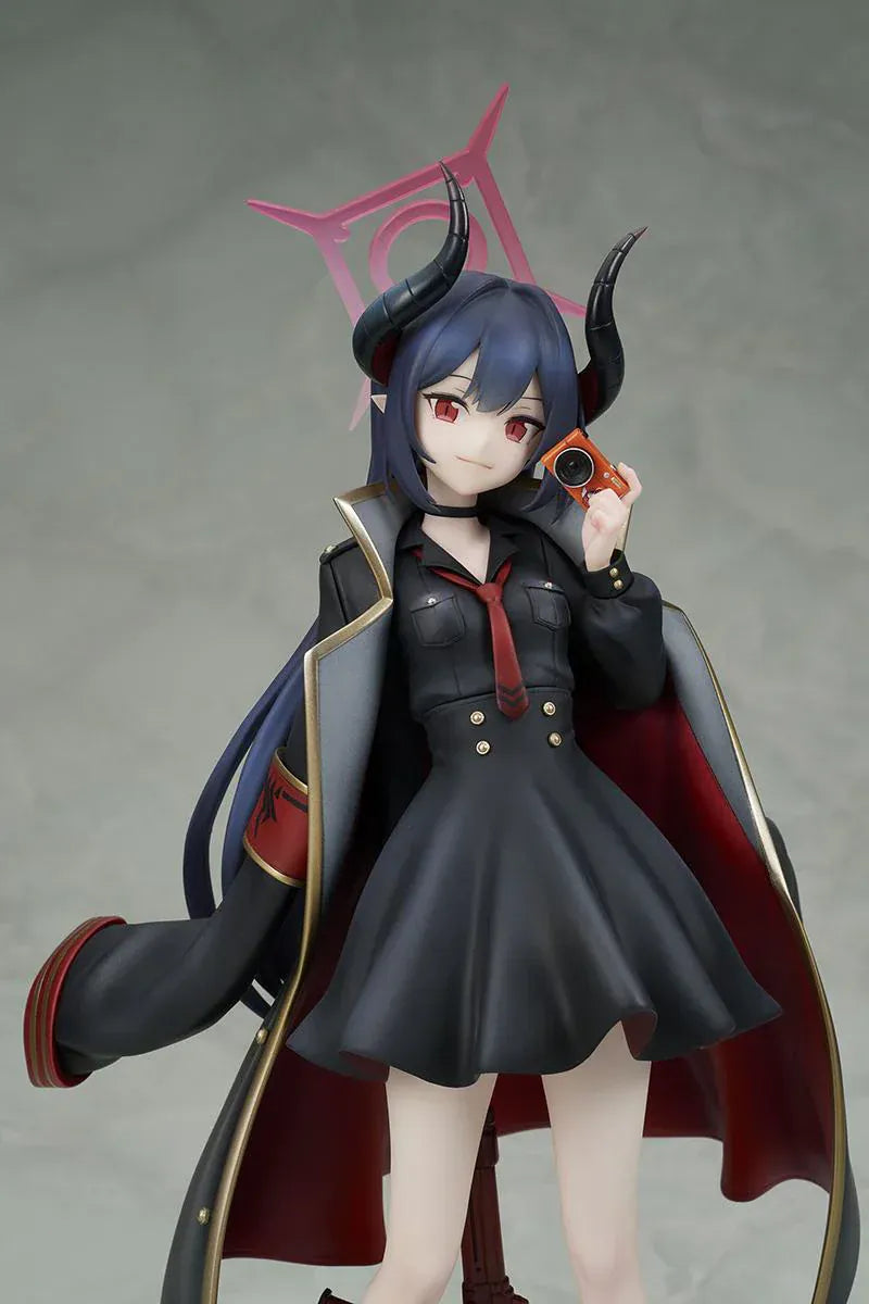 Blue Archive Chiaki 1/7 scale figure wearing dark uniform with long coat holding camera and rifle accessory.