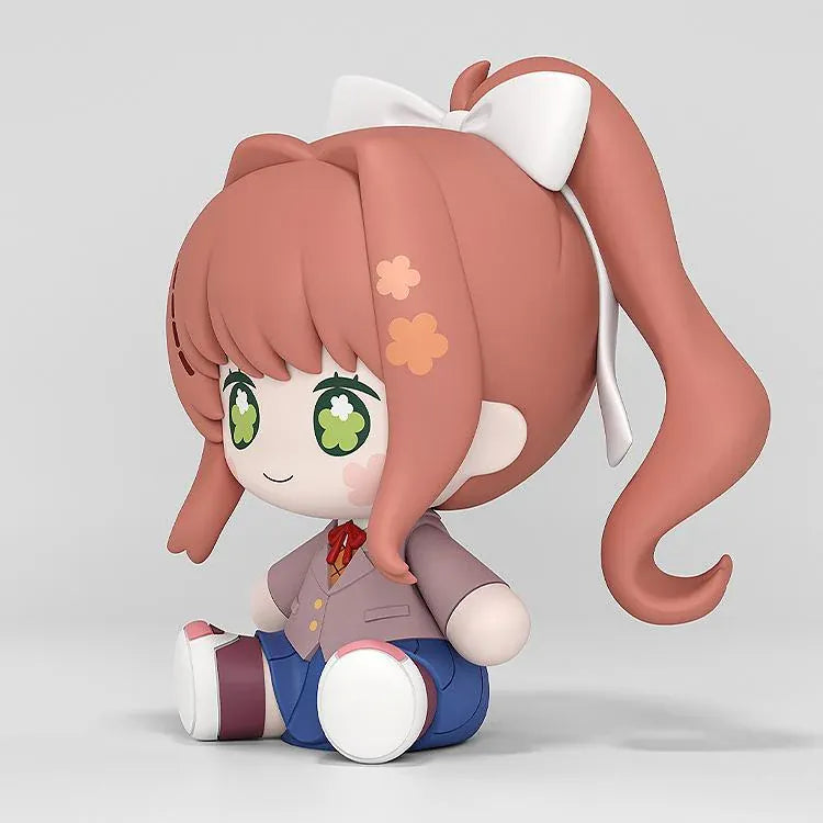 Doki Doki Literature Club! Huggy Good Smile Monika figure with green flower-filled eyes, a white hair bow, and a school uniform in a seated pose.