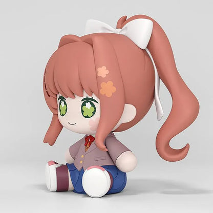 Doki Doki Literature Club! Huggy Good Smile Monika figure with green flower-filled eyes, a white hair bow, and a school uniform in a seated pose.
