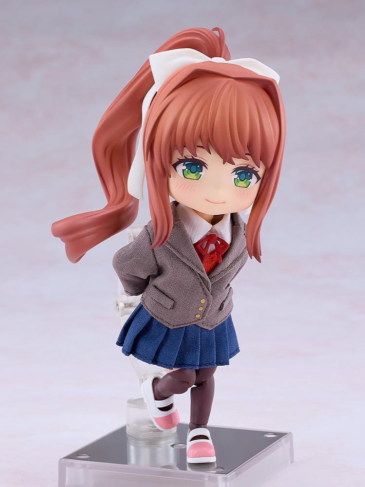 Doki Doki Literature Club! Nendoroid Doll Monika wearing a fabric brown blazer, blue pleated skirt, red ribbon, and white hair bow.