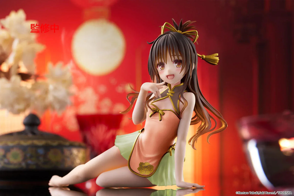 To Love-Ru Darkness Desktop Cute Mikan Yuki Chinese Dress Ver. Figure (Rerelease) featuring a brown-haired anime girl with golden eyes wearing an orange Chinese-style dress with gold trim, a light green ruffled skirt, and decorative hair ribbons in a seated pose.