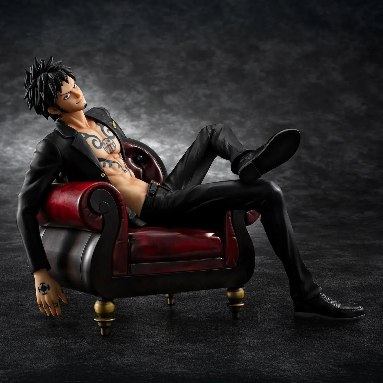 One Piece Portrait Of Pirates S.O.C. Trafalgar Law Ver. R Figure wearing a black suit and sitting in a red armchair