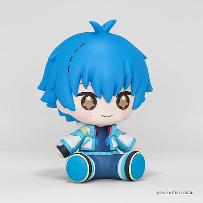 DRAMAtical Murder Huggy Good Smile Aoba figure with blue hair, star-filled eyes, headphones, and a blue-and-white outfit in a seated pose.