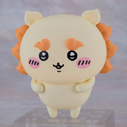 Chiikawa Nendoroid Shisa figure with a cream-colored body, orange mane and eyebrows, pink cheeks, and a joyful smiling expression.