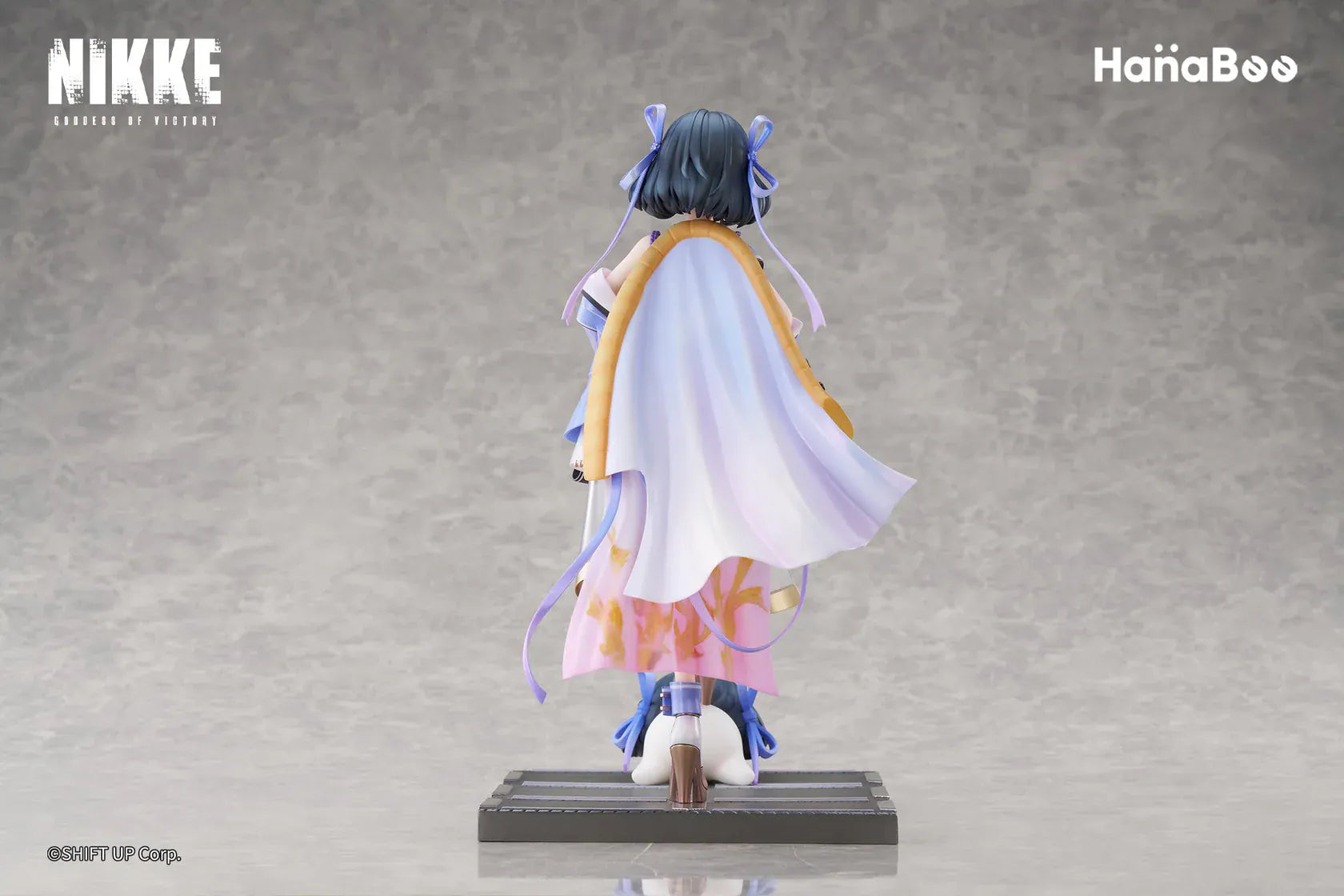 Goddess of Victory Nikke Syuen Deluxe Edition 1/6 Scale Figure featuring Syuen in a white-and-purple outfit with ribbon details, themed base, chibi mascot accent, can badge, and acrylic-style bonus artwork.