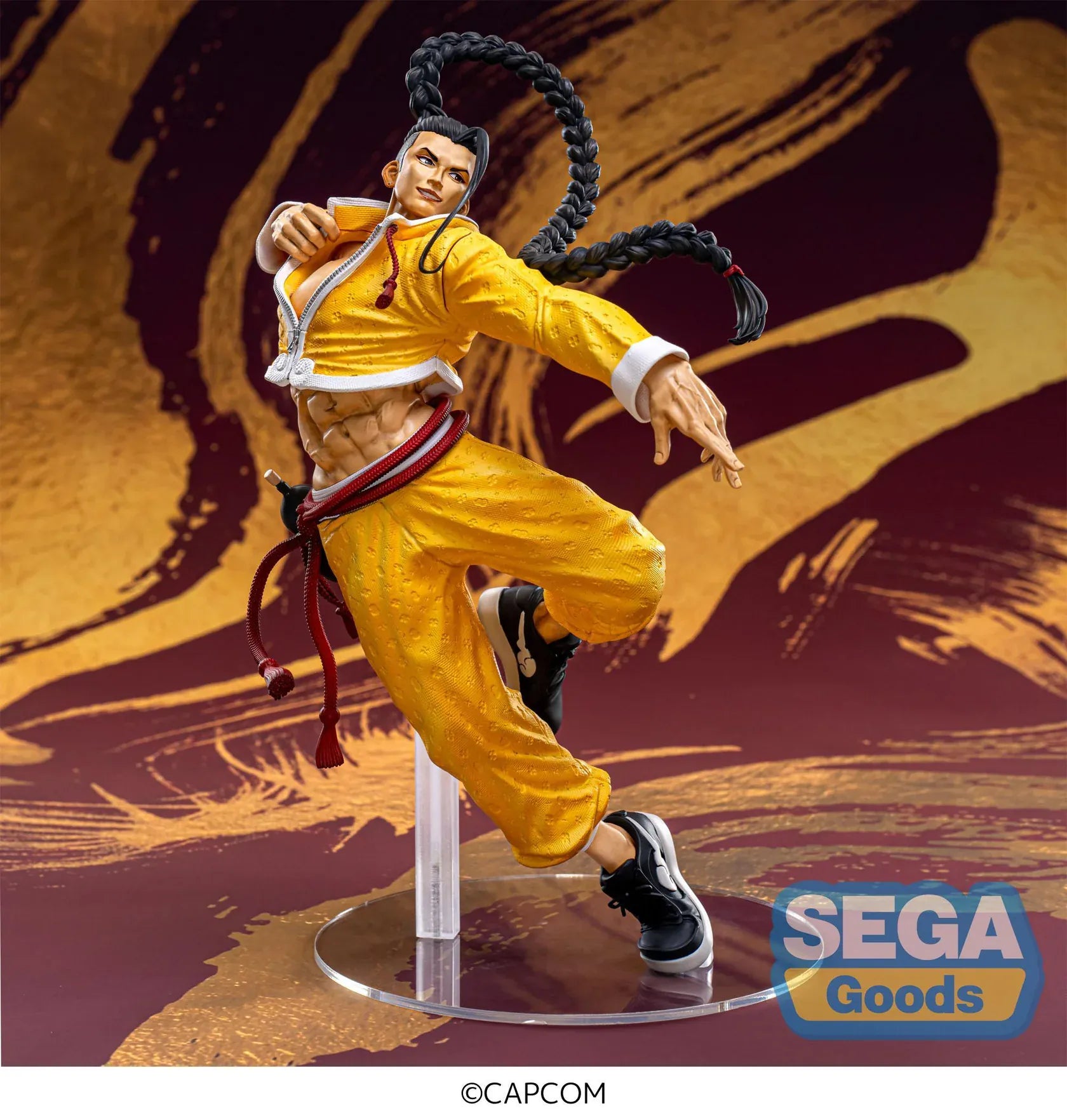 Street Fighter 6 FiGURiZMa Jamie figure in a dynamic martial arts pose with signature yellow outfit and braided hair