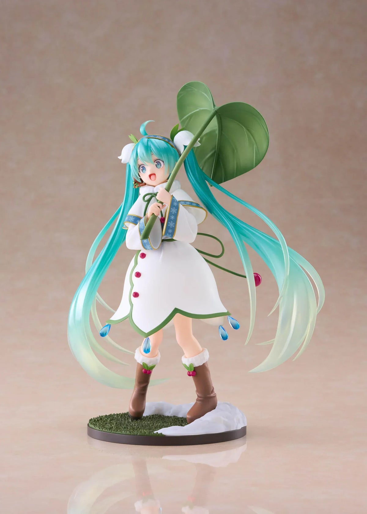 Snow Miku All Stars 2015 Ver. AMP+ figure wearing a white flower-inspired dress and holding an oversized green leaf.