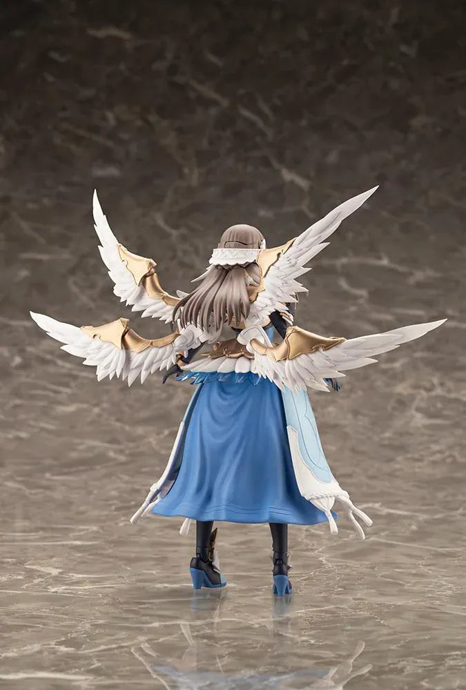 Assembled Arcanadea Ermeda model kit with long brown hair, white feathered wings, a blue and white outfit, gold armor accents, and armored boots.