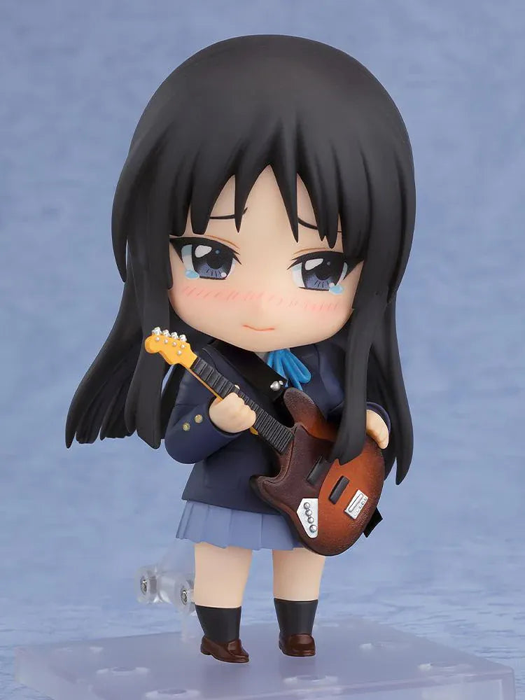 K-ON! Nendoroid Mio Akiyama 2.0 figure with long black hair, her school uniform, blue ribbon, and left-handed bass guitar.
