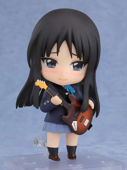 K-ON! Nendoroid Mio Akiyama 2.0 figure with long black hair, her school uniform, blue ribbon, and left-handed bass guitar.