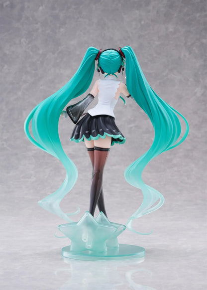 Vocaloid T-Most Hatsune Miku NT Ver. Figure featuring Miku with long teal twin tails, headphones, black-and-white outfit, wink expression, peace-sign pose, and star-themed base.