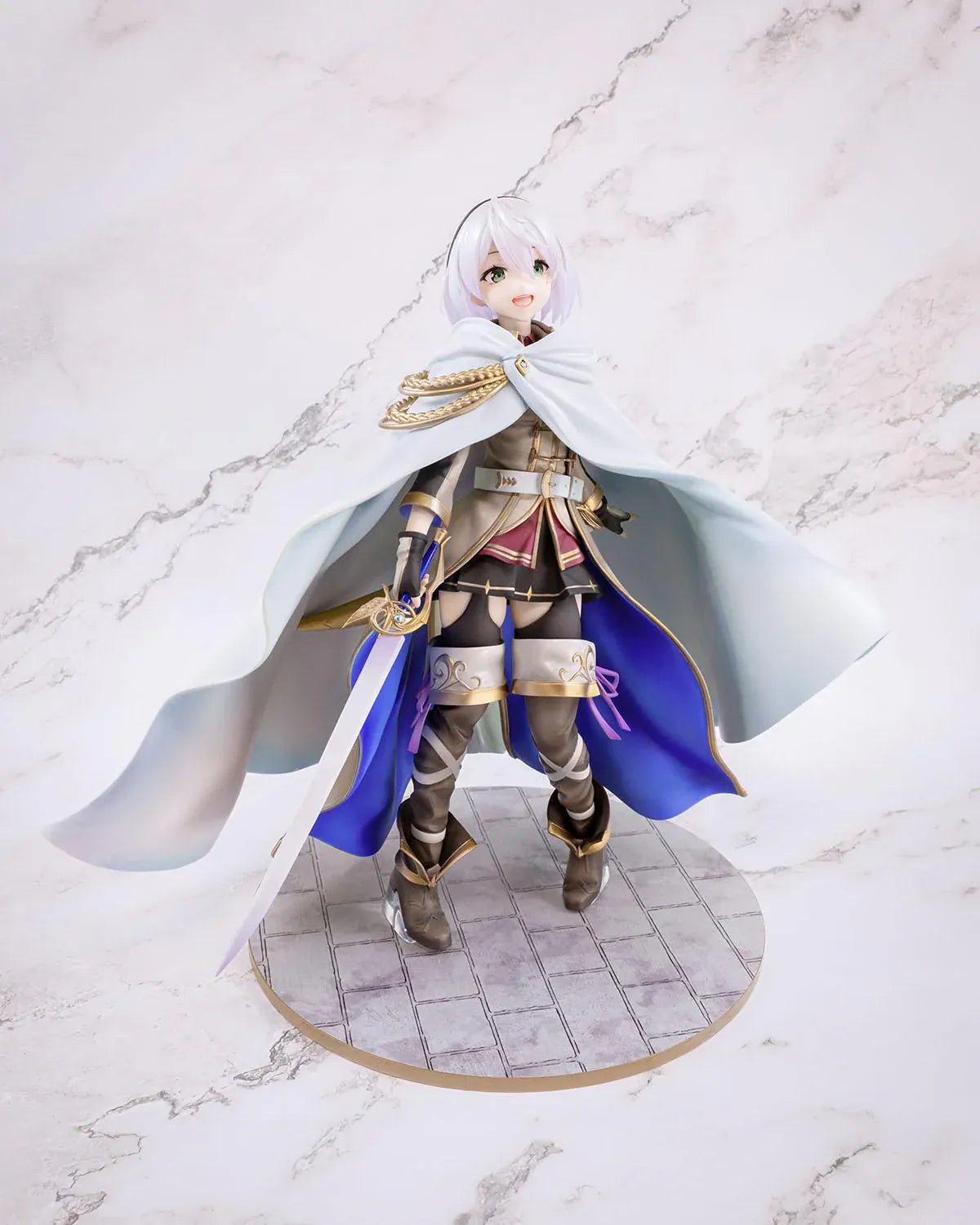 Wandering Witch The Journey of Elaina Amnesia 1/7 Scale Figure featuring Amnesia with short silver hair, white cape, sword, and stone-style display base.