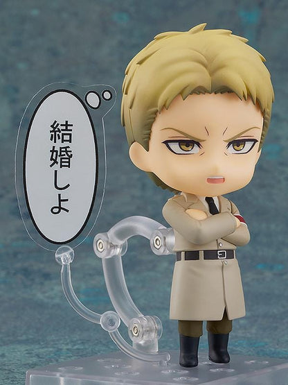 Attack on Titan Nendoroid Reiner Braun rerelease figure with blonde hair, facial stubble, crossed arms, and a tan Marleyan uniform.