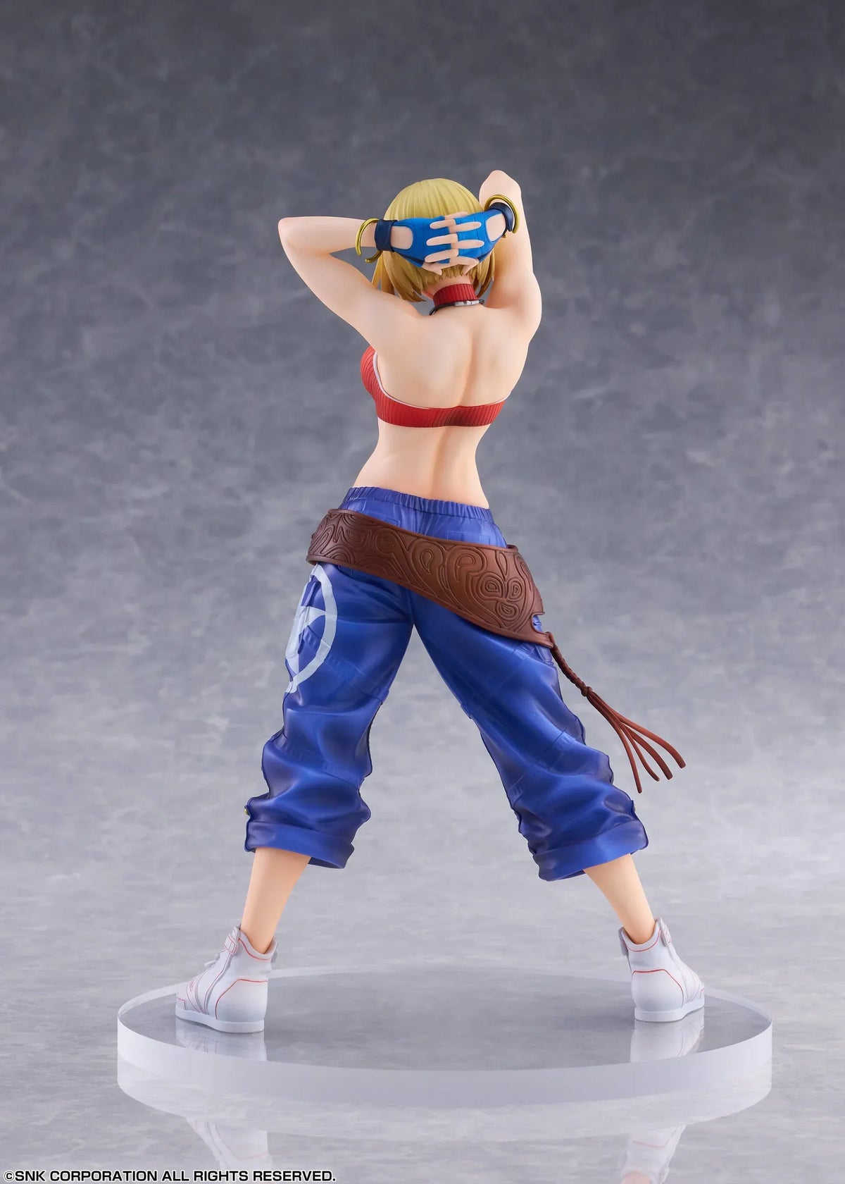 Blue Mary Limited Edition 1/7 scale figure wearing a red crop top, blue pants, brown belt, and white sneakers in a confident standing pose.