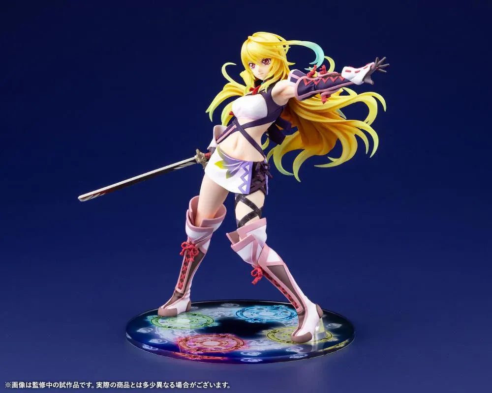 Tales of Xillia Milla Maxwell 1/8 scale figure holding a sword in a battle pose on a colorful elemental display base.