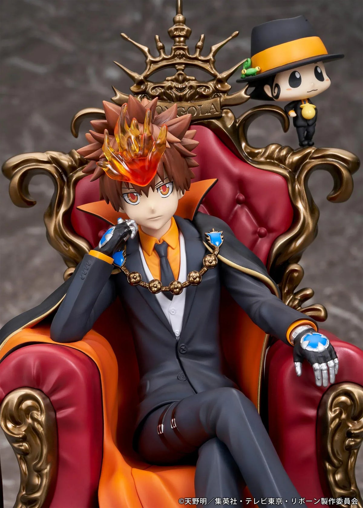REBORN! Tsunayoshi Sawada & Reborn Scale Figure featuring Tsuna with spiky brown hair, a fiery Dying Will Flame, black suit, and orange-lined cape seated on an ornate golden throne with red upholstery, accompanied by Reborn in his signature fedora.