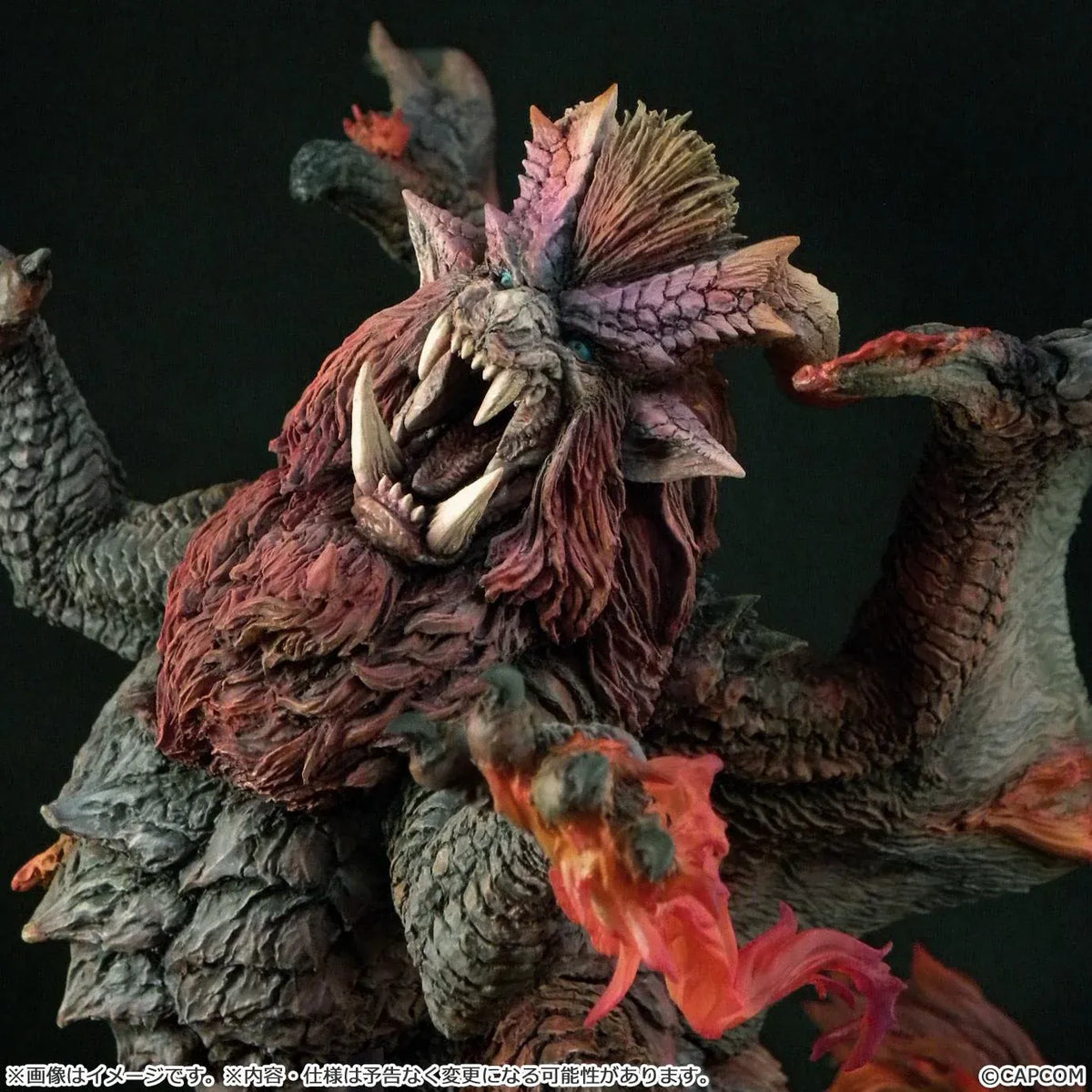 Monster Hunter Capcom Figure Builder Creator's Model Teostra (Rerelease) featuring a fearsome Elder Dragon with massive outstretched wings, a fiery red mane, sharp horns, detailed scales, and red flame effects atop a rocky display base.