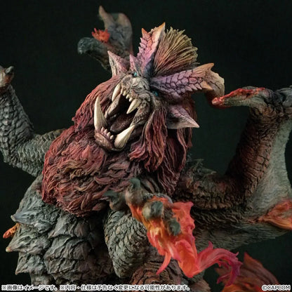Monster Hunter Capcom Figure Builder Creator's Model Teostra (Rerelease) featuring a fearsome Elder Dragon with massive outstretched wings, a fiery red mane, sharp horns, detailed scales, and red flame effects atop a rocky display base.