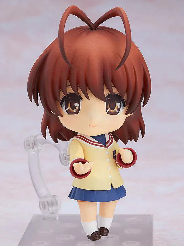 CLANNAD Nendoroid Nagisa Furukawa Figure featuring Nagisa in a chibi-style design with brown hair, cream cardigan, blue skirt, and school uniform details.