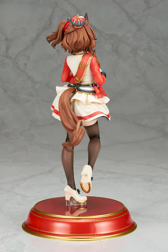 UmaMusume Pretty Derby Aston Machan 1/7 Scale Figure featuring Aston Machan with horse ears, short brown hair, red-and-cream outfit, plush doll accessory, and themed display base.