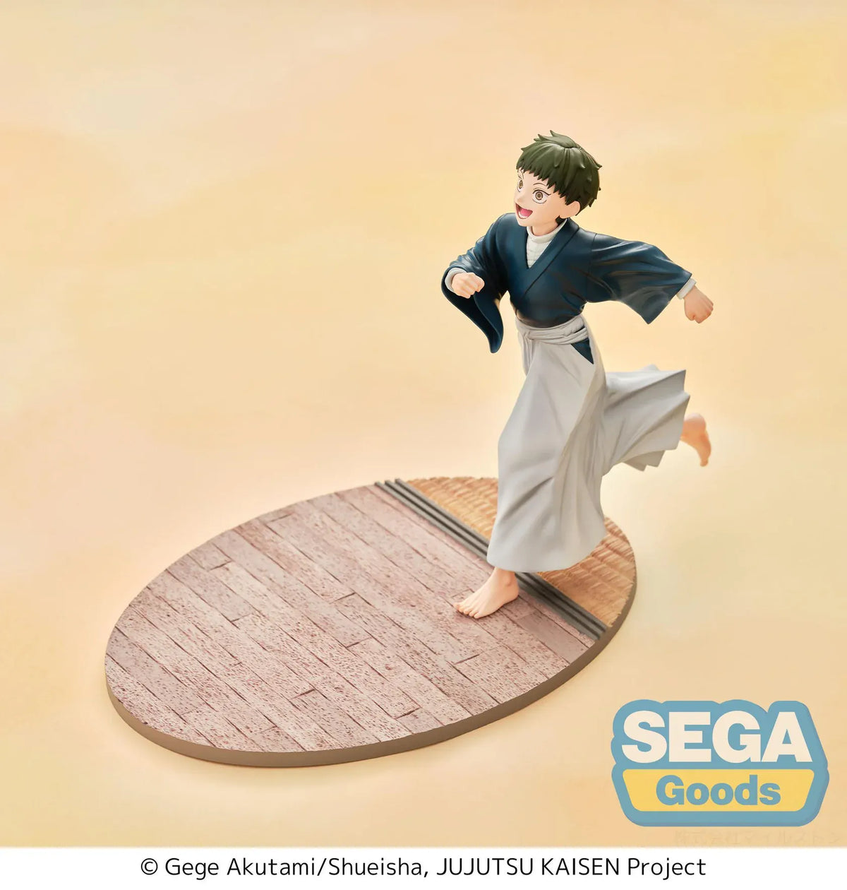 Luminasta Naoya Zen’in Childhood figure running barefoot in a blue top and gray hakama, smiling on an oval base with wood-style flooring.