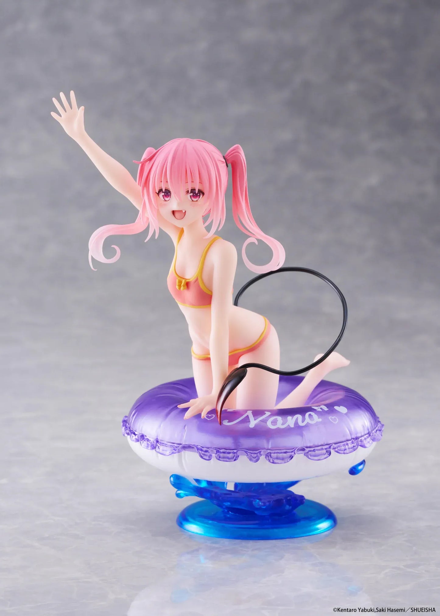 To Love-Ru Darkness Aqua Float Girls Nana figure featuring Nana with pink twin tails in a swimsuit posing on a purple float ring display base