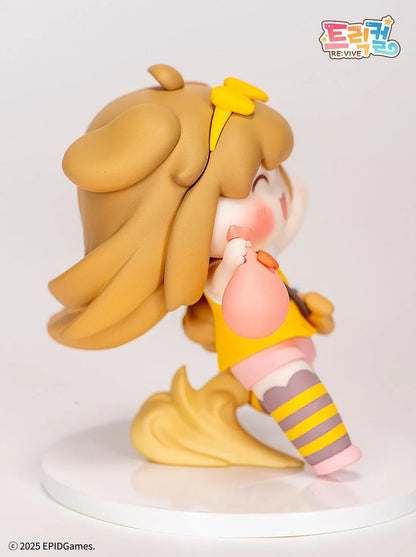 Trickal Chibi Go Butter Non Scale Figure (Rerelease) featuring a cheerful brown-haired character with floppy dog ears, a yellow bow, pink shorts, striped stockings, and a puppy-shaped shoulder bag.