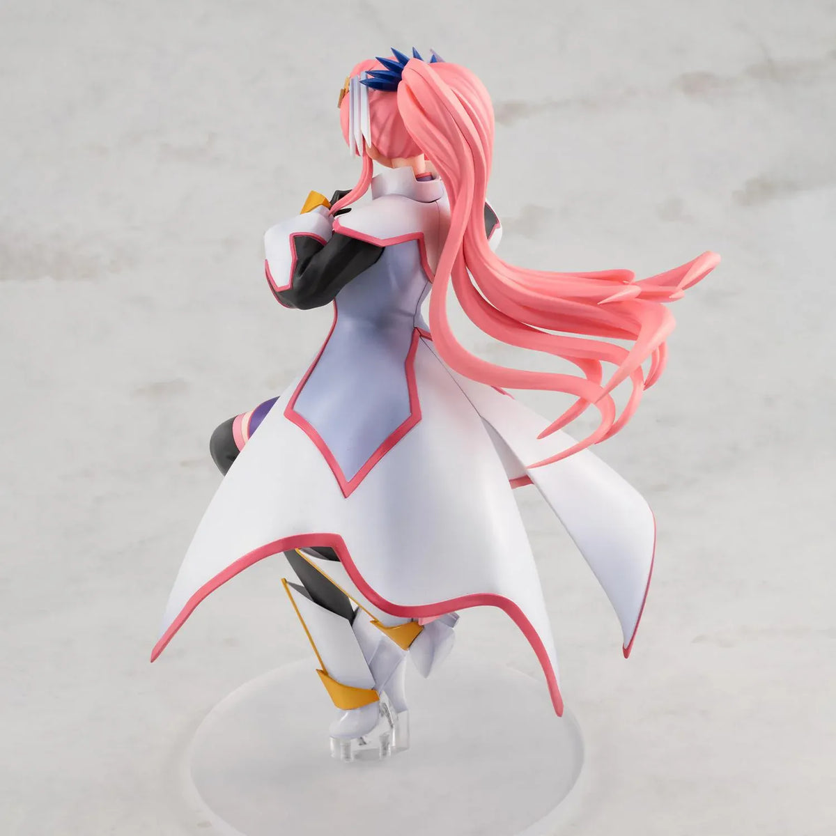 Gundam Girls Generation Lacus Clyne Battle Surcoat Ver. figure with flowing pink hair, a white surcoat with pink trim, and one gloved hand extended.